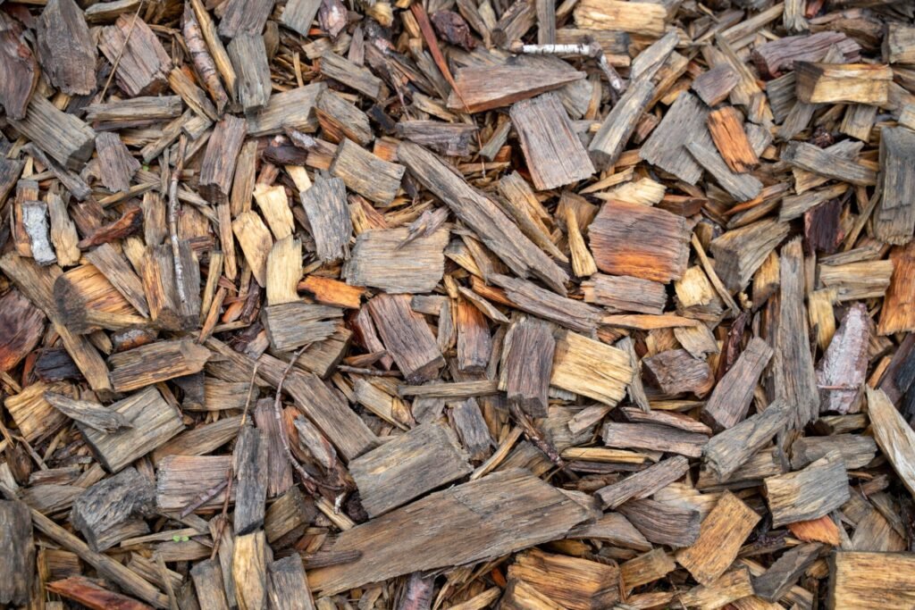 pexels-photo-13863305-13863305 Detailed close-up of dry cut firewood pieces, perfect for gardening.