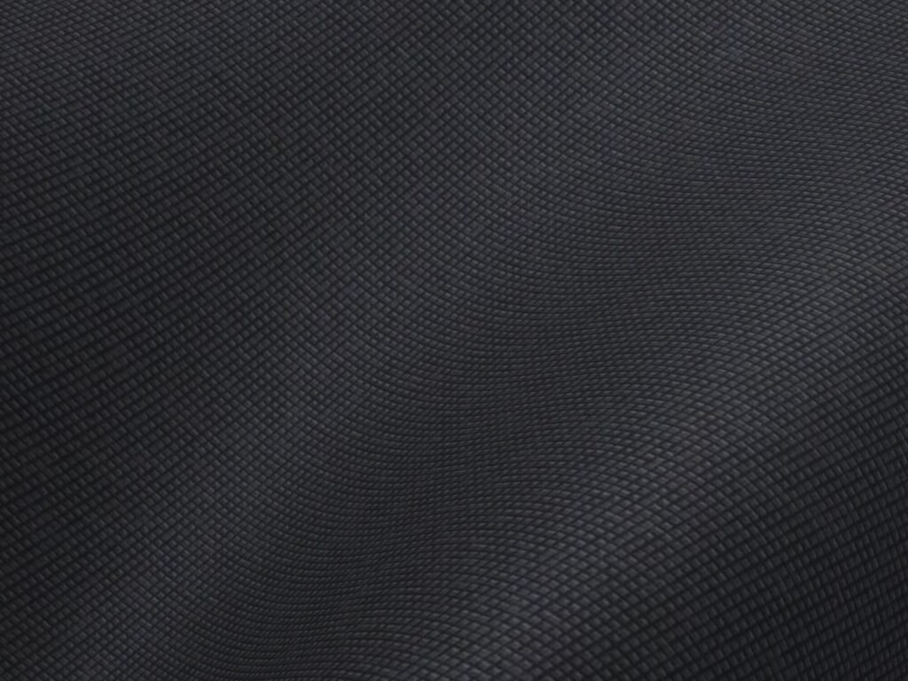 Close-up of abstract textured fabric with a dark color palette and small grid pattern.